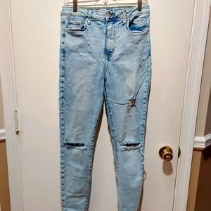 Women's Forever 21 light jeans. Size 30. Ripped throughout.